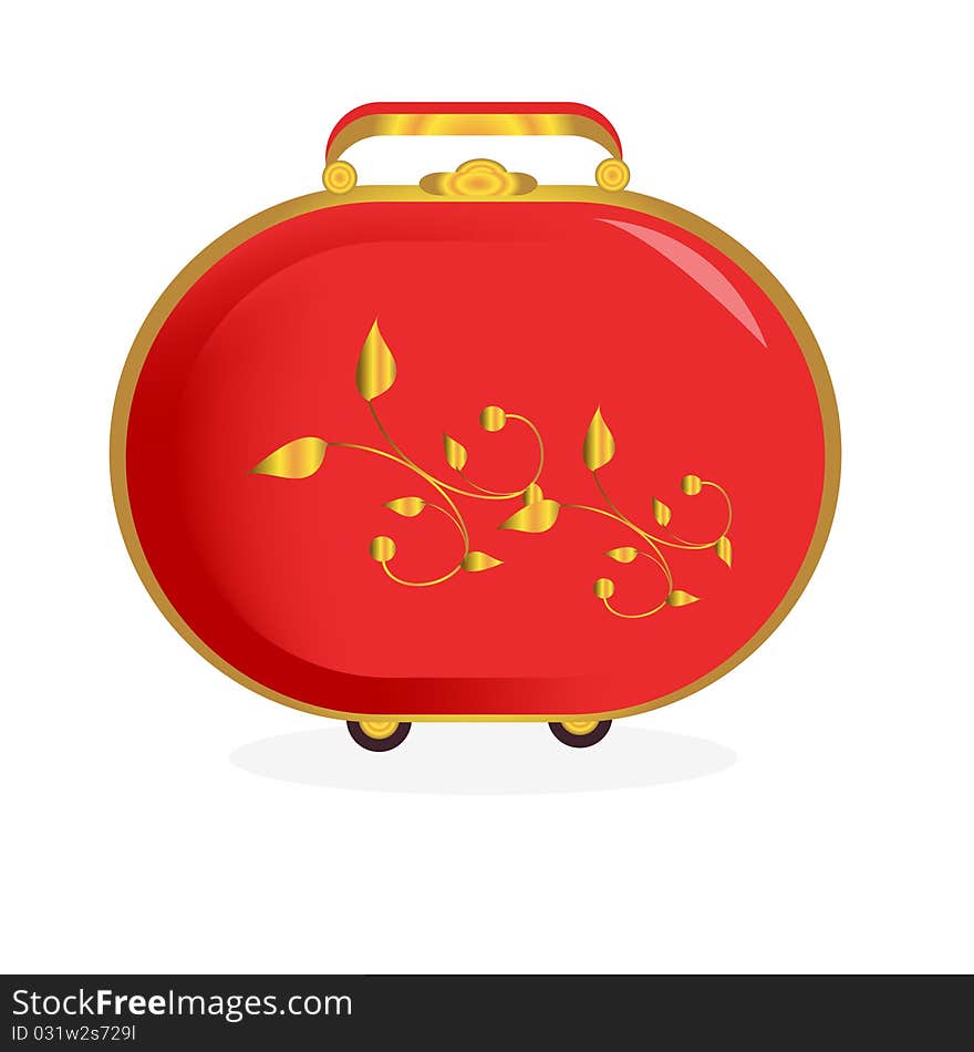 The red suitcase decorated with gold curls