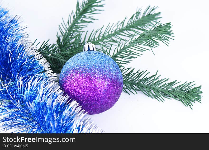 Colored christmas ball with green brunch