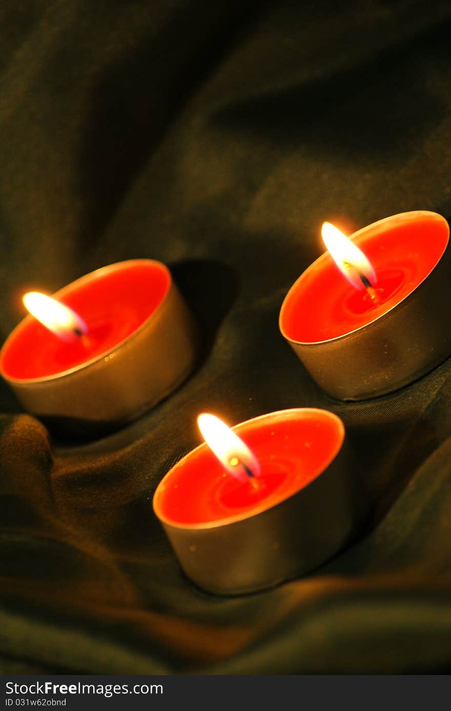 Still life with candles and textile