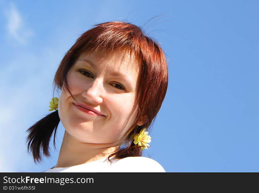 Pretty smiling woman on sky background. Pretty smiling woman on sky background