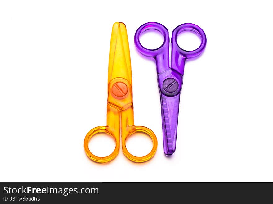 Childres' plastic scissors, isolated on white. Childres' plastic scissors, isolated on white