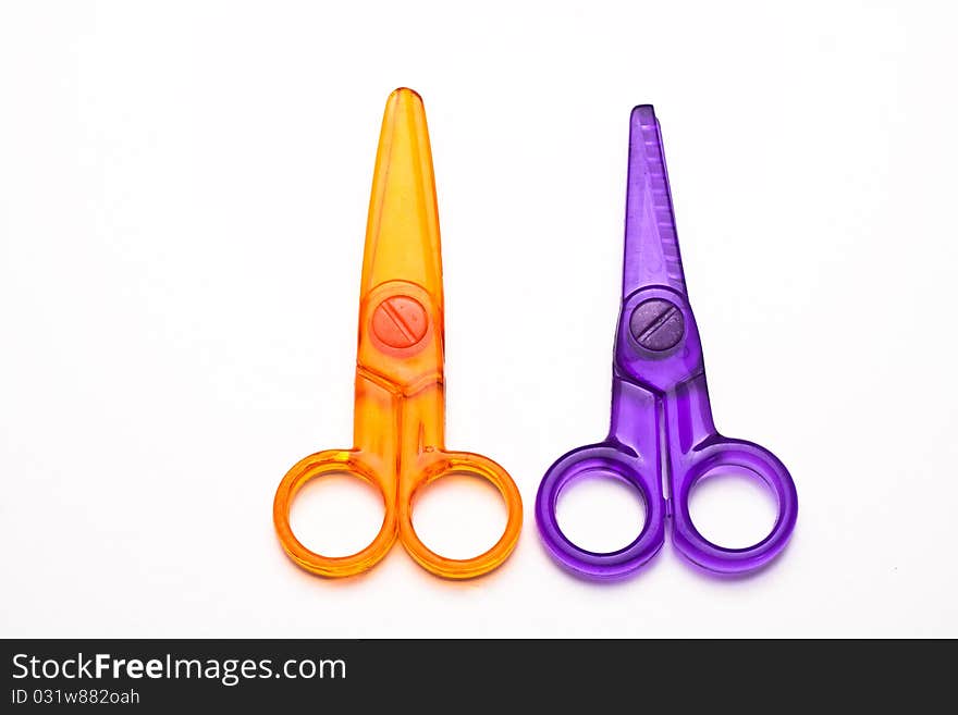 Childres' plastic scissors, isolated on white. Childres' plastic scissors, isolated on white