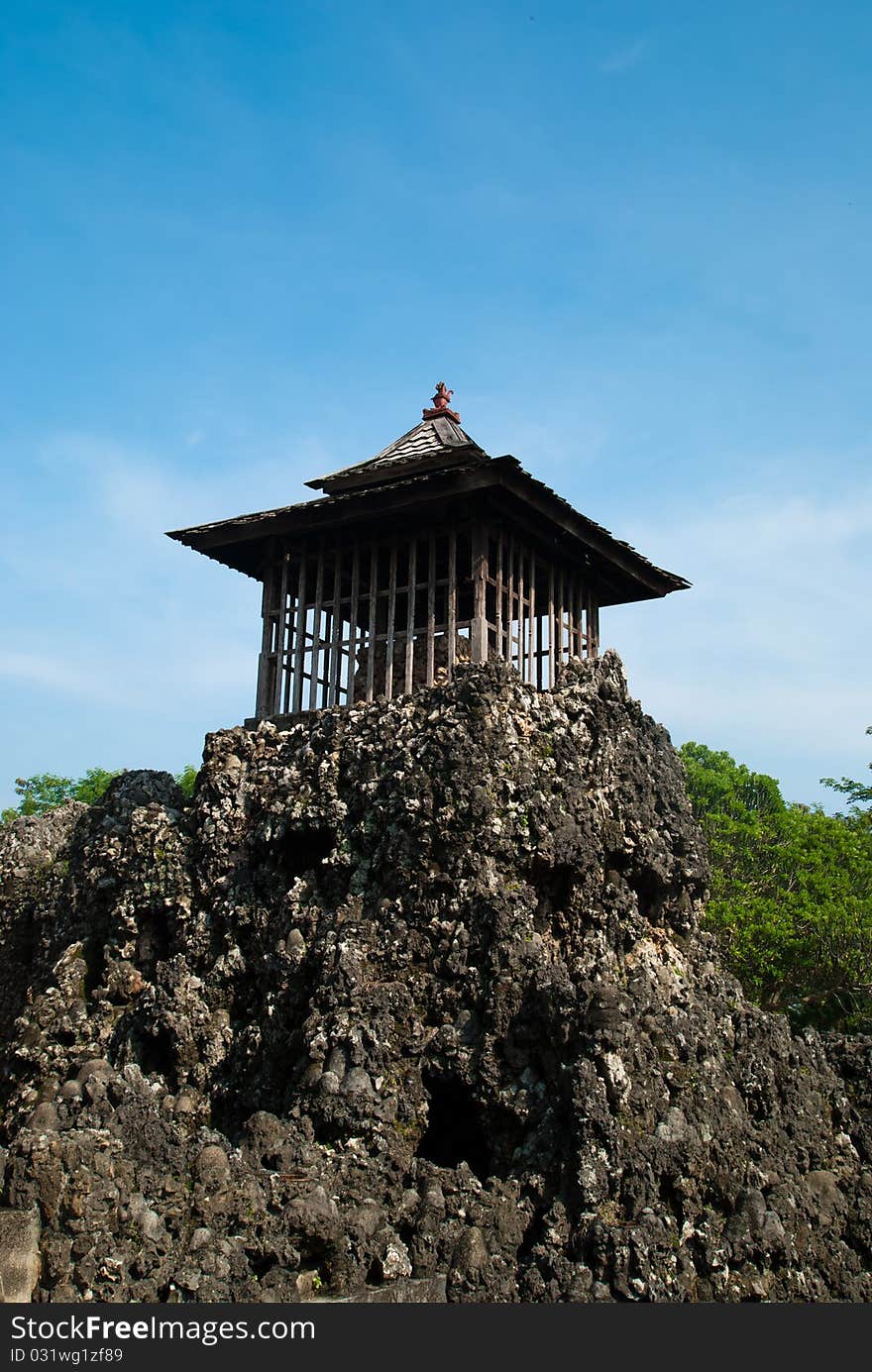 A unique rocky temple in portrait mode with blue sky