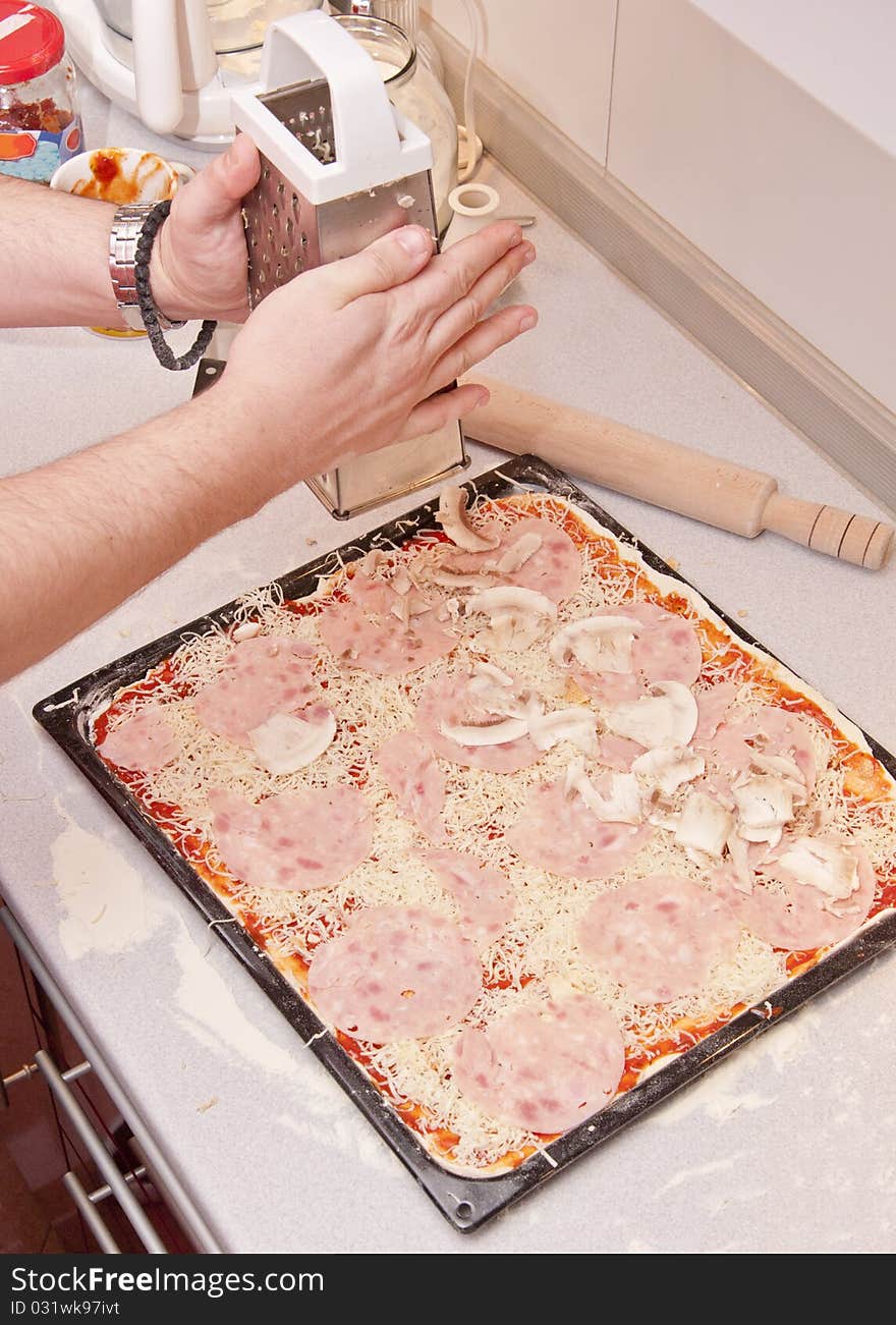 Preparing pizza in a pizzeria