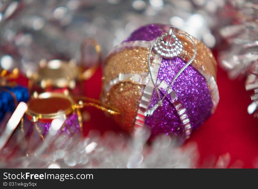 Varicoloured christmas balls on red background . Varicoloured christmas balls on red background .