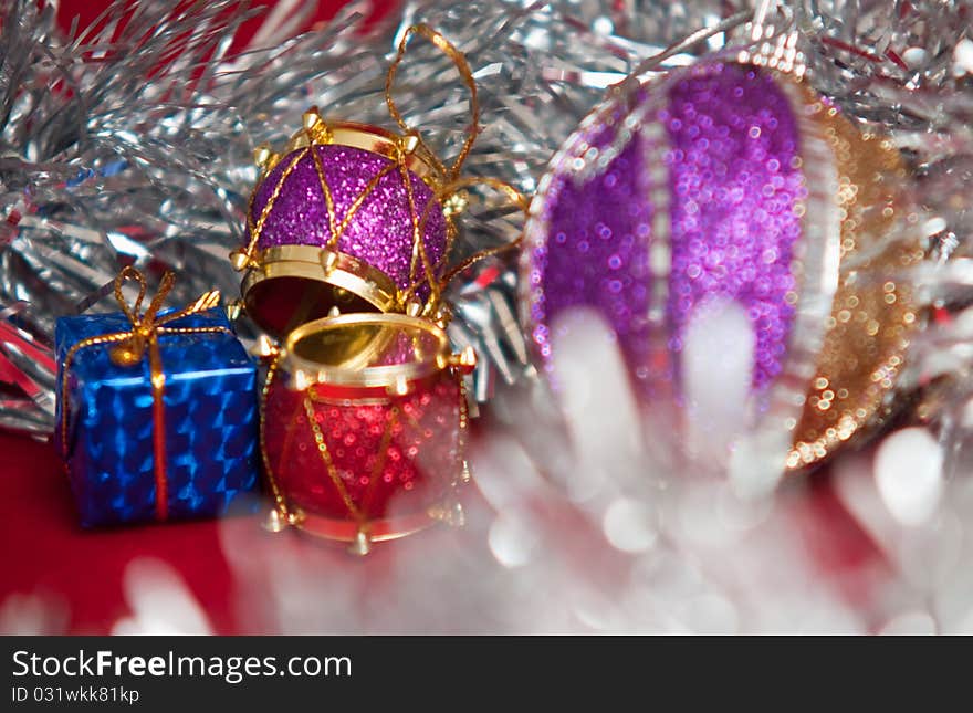 Varicoloured christmas balls on red background . Varicoloured christmas balls on red background .