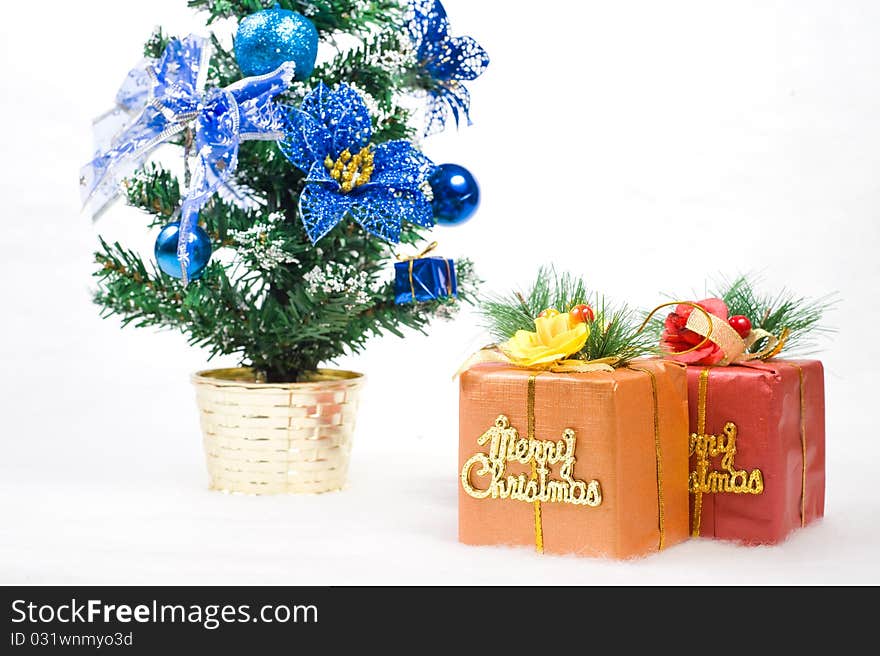 Two gift boxes with a christmas tree