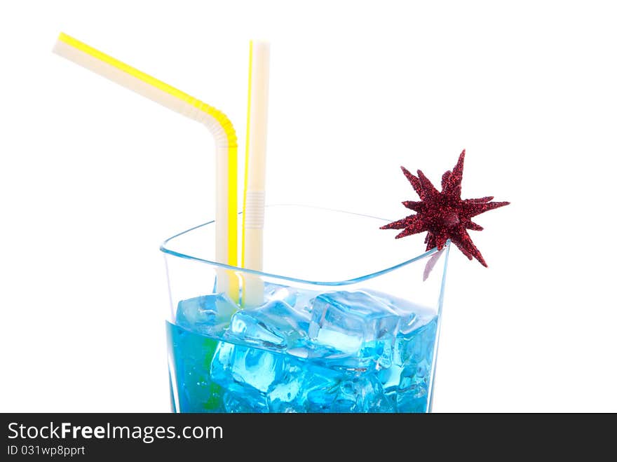 Blue Hawaiian Cocktails with vodka, light rum, gin, tequila, blue curacao, lime juice, lemonade, two yellow striped strawsand christmas star isolated on a white background