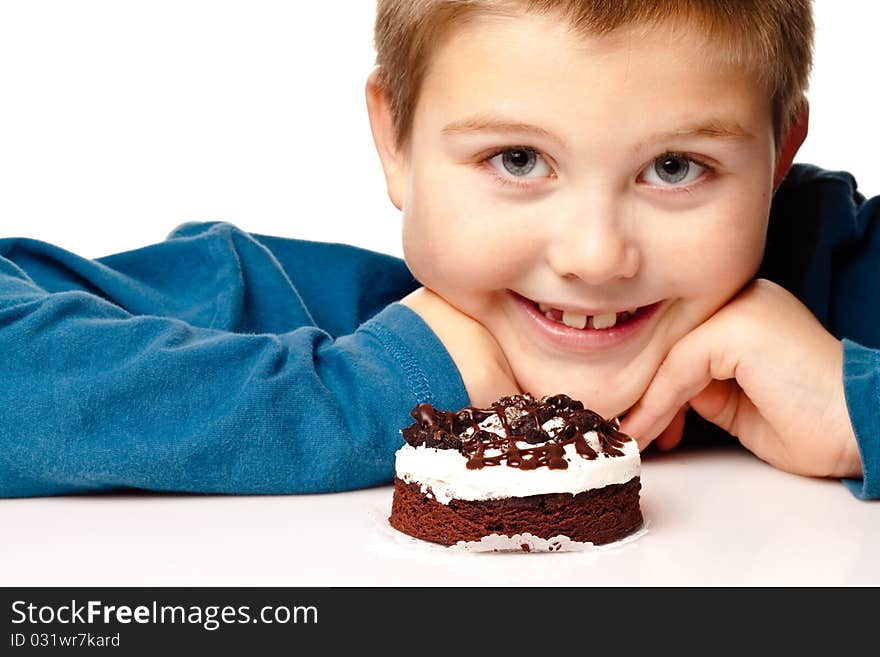 Young Boy deciding to eat dessert