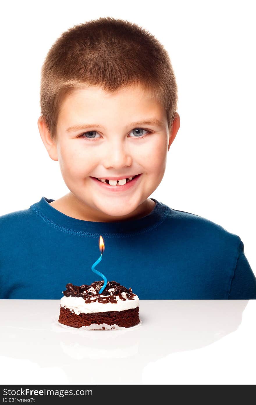 Young Boy Deciding To Eat A Dessert