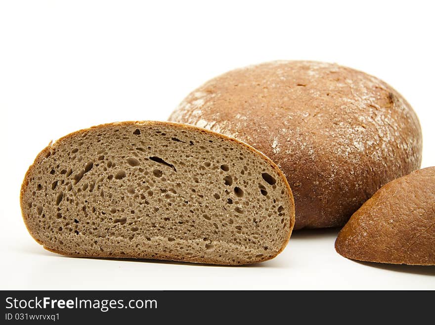 Round bread cut onto white background