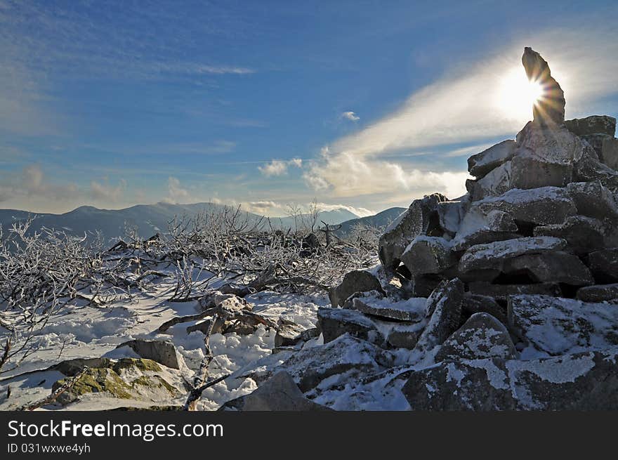 Pyramid from stones at mountain top.