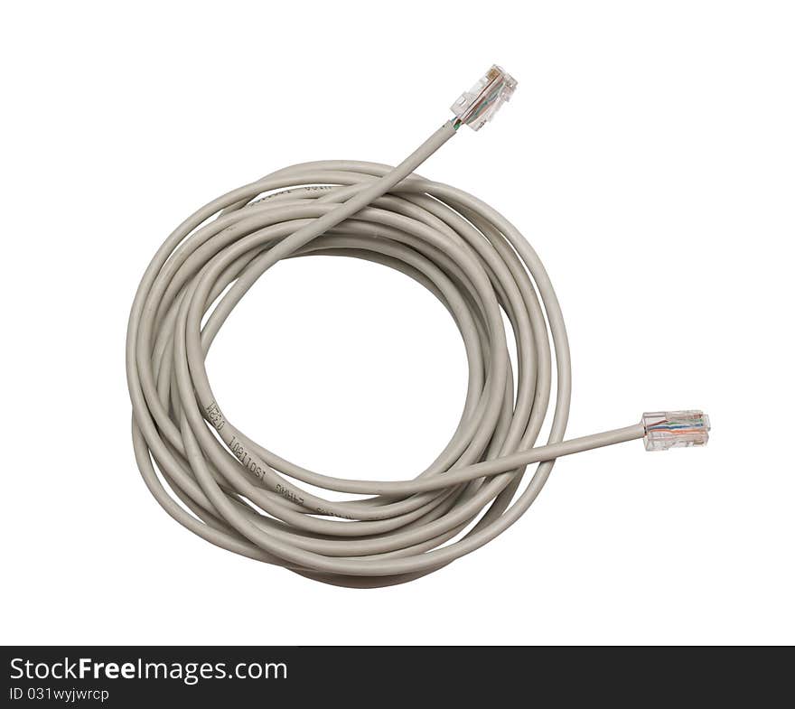 Network cable irregularly wound in a roll isolated on white background