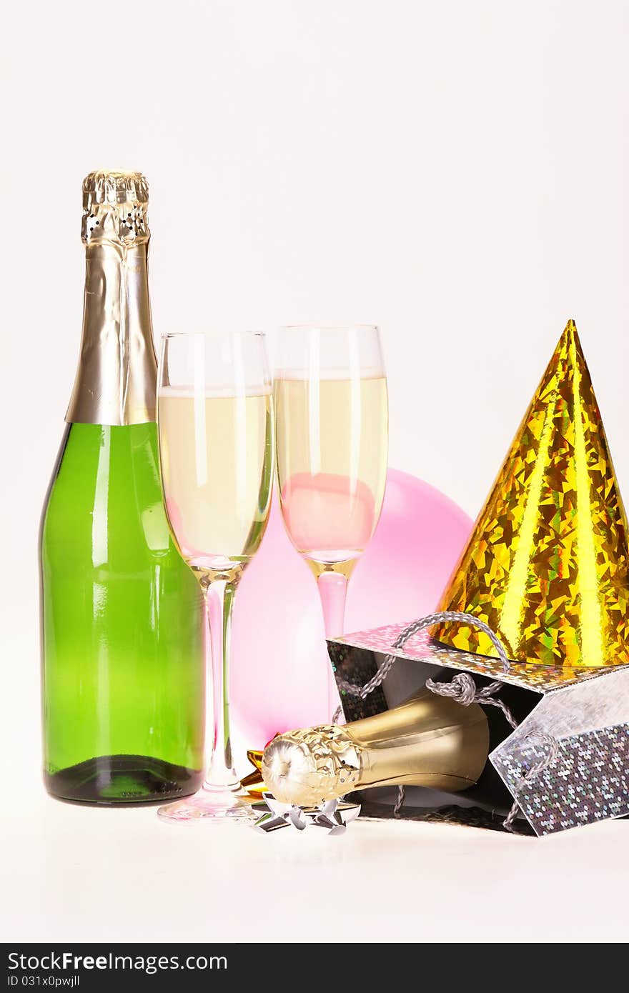 Champagne and party time on white background