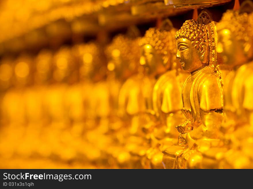 Buddha, many stuck to the wall a Chinese temple in Thailand. Buddha, many stuck to the wall a Chinese temple in Thailand