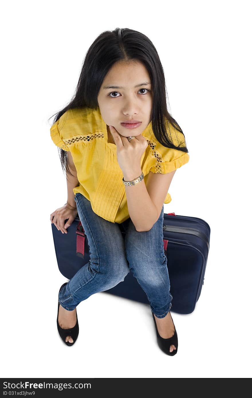 Pretty woman sitting on a bag