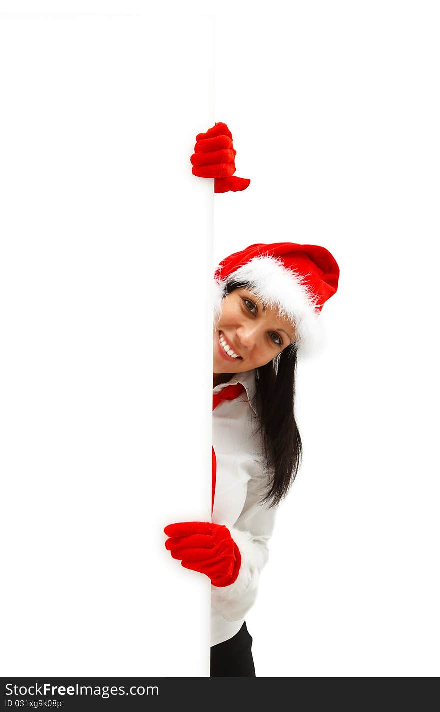 Female Santa with red hat and gloves behind a white billboard. Female Santa with red hat and gloves behind a white billboard