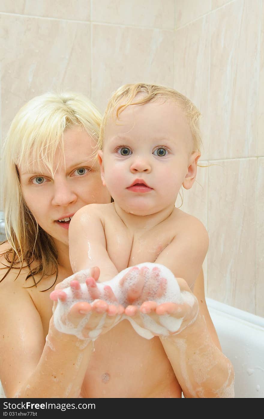 Mother and her son in the bathroom. Mother and her son in the bathroom