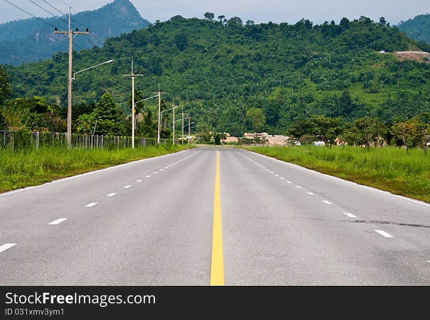 Road beside dam in country, Thailand. Road beside dam in country, Thailand.