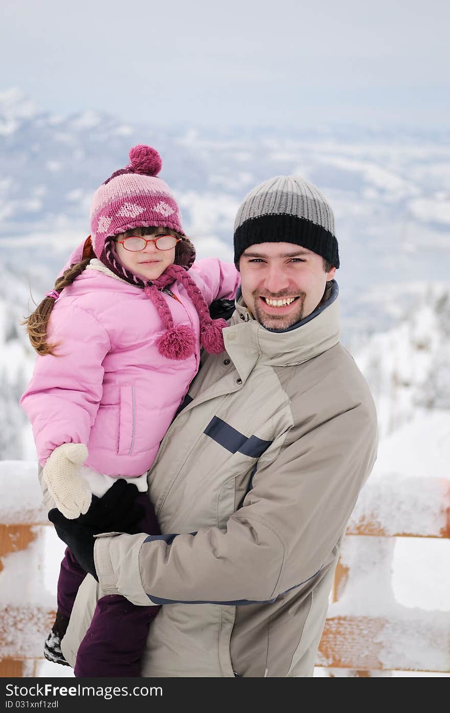 Young Father And His Daughter In Mountains