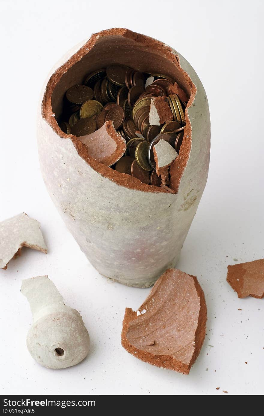 Broken piggy bank on a white background