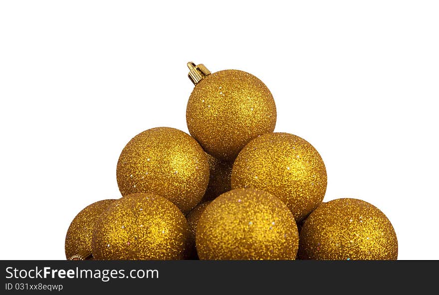 Pyramid of golden Christmas balls isolated on white