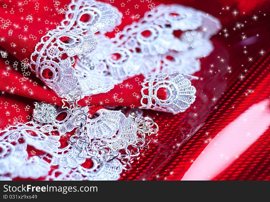 Red Christmas background with lace and serpentine