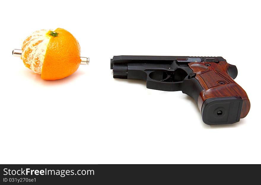 The close up of a pistol  Rakes a tangerine is isolated on a white background. The close up of a pistol  Rakes a tangerine is isolated on a white background