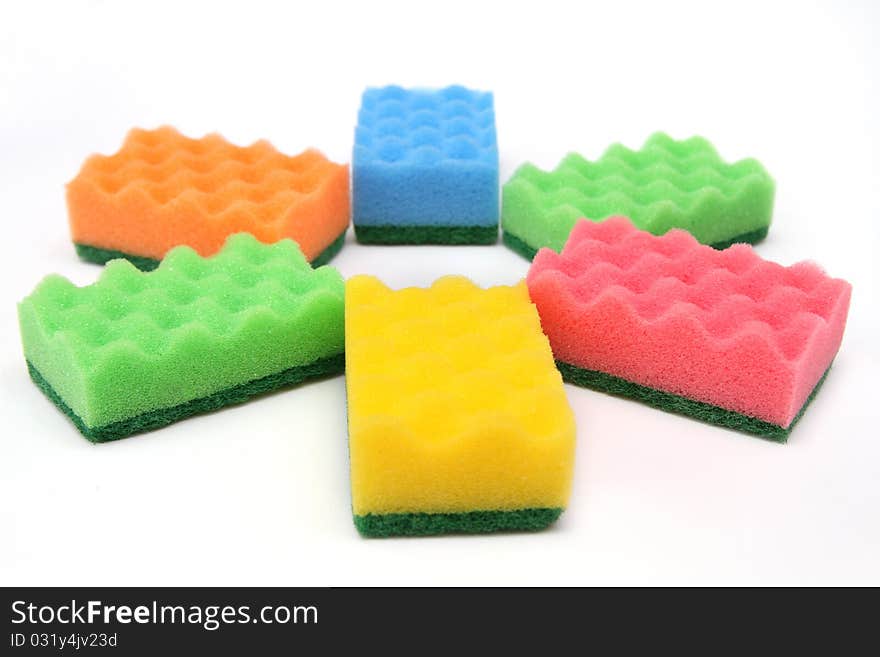 Close-up of bright-colored sponges for cleaning and home care - isolated on white background. Close-up of bright-colored sponges for cleaning and home care - isolated on white background