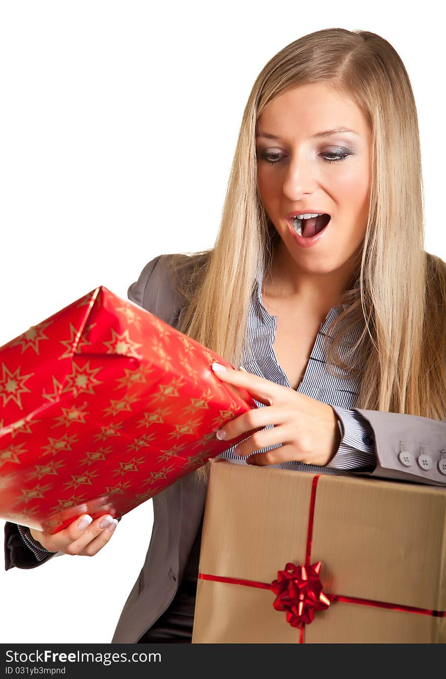 Blond caucasian woman in formal dress with gift boxes isolated on white. Blond caucasian woman in formal dress with gift boxes isolated on white