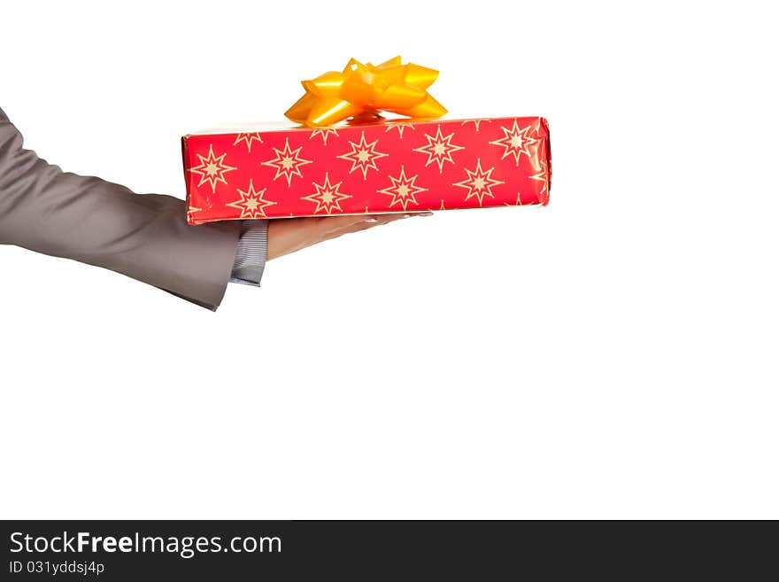 Woman hand holding christmas present on white background