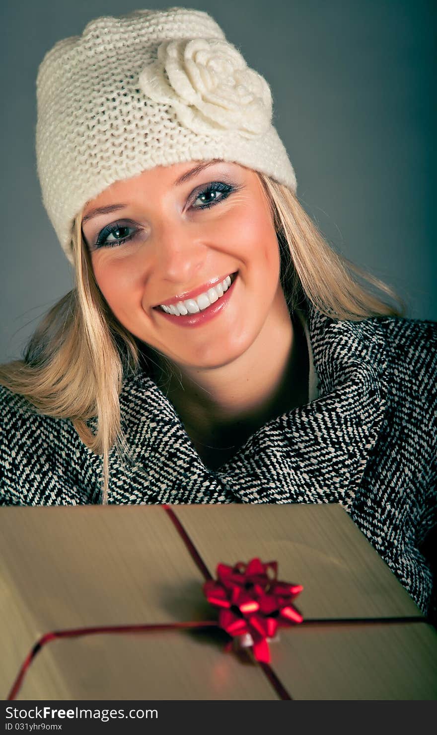 Portrait of beautiful blond woman in warm clothes on blue background. Portrait of beautiful blond woman in warm clothes on blue background