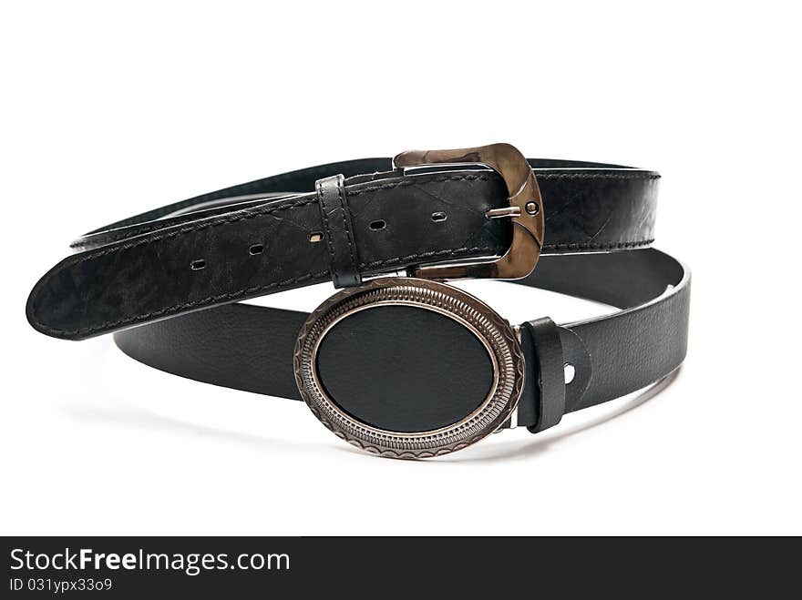 Two leather belts isolated on white background. Two leather belts isolated on white background