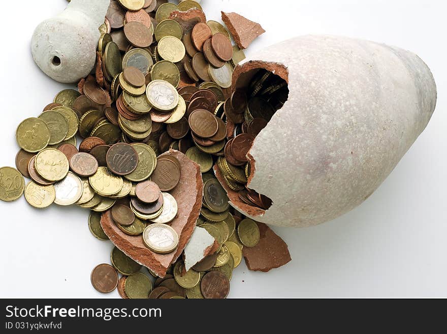 Broken piggy bank on a white background