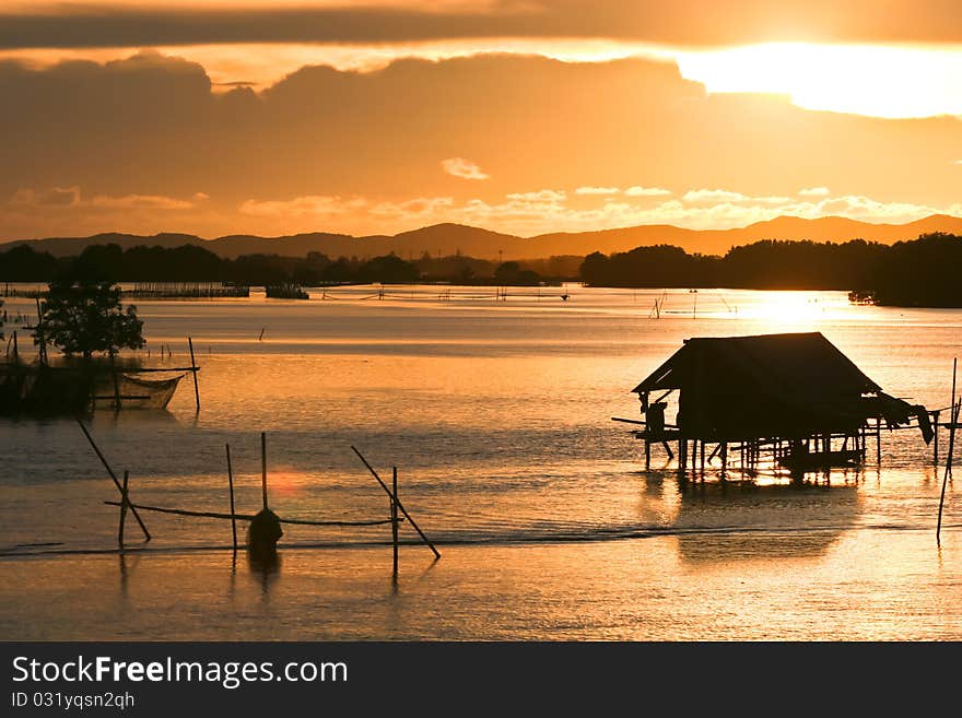 Fisherman lifestyle on sunset at Thailand