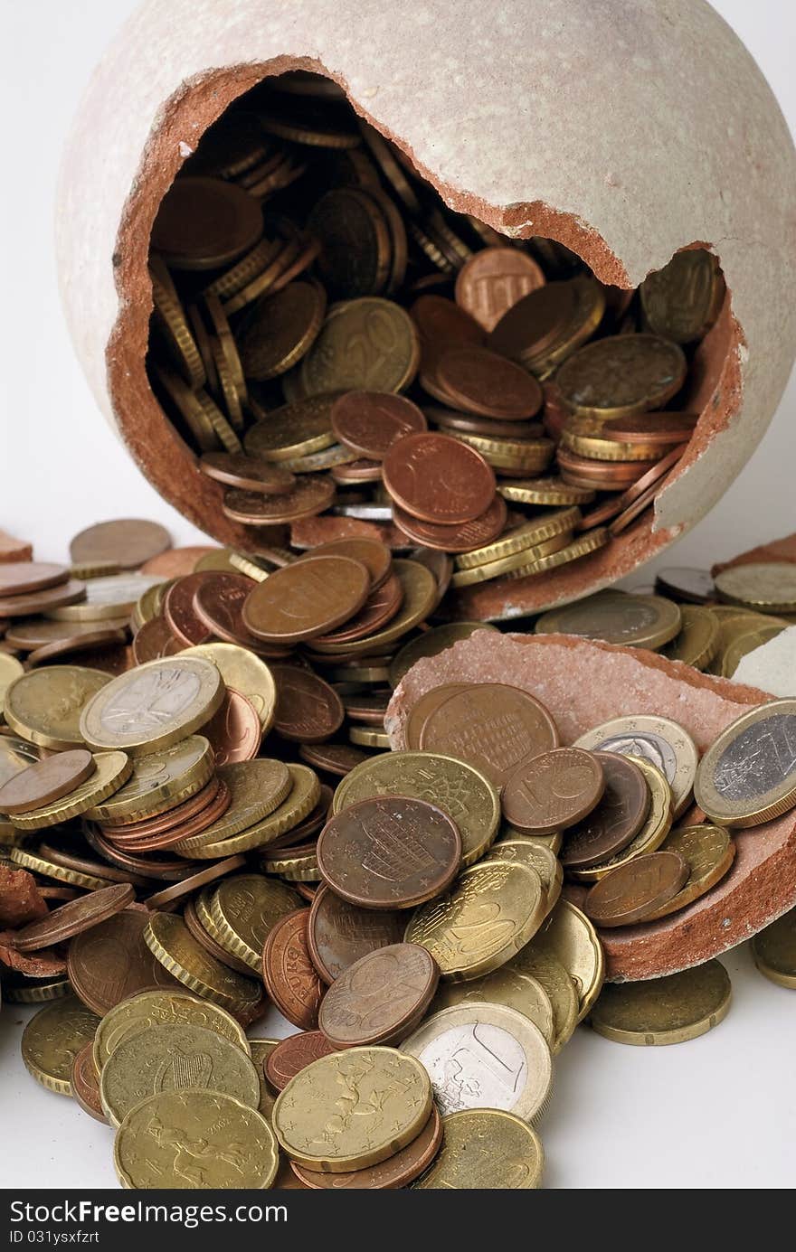 Broken piggy bank on a white background