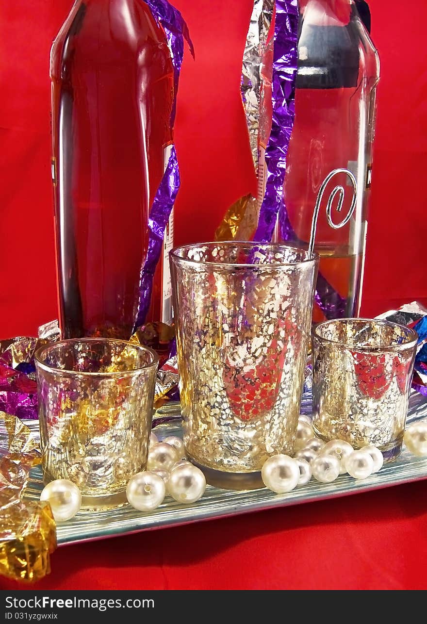 Cups and wine on red background