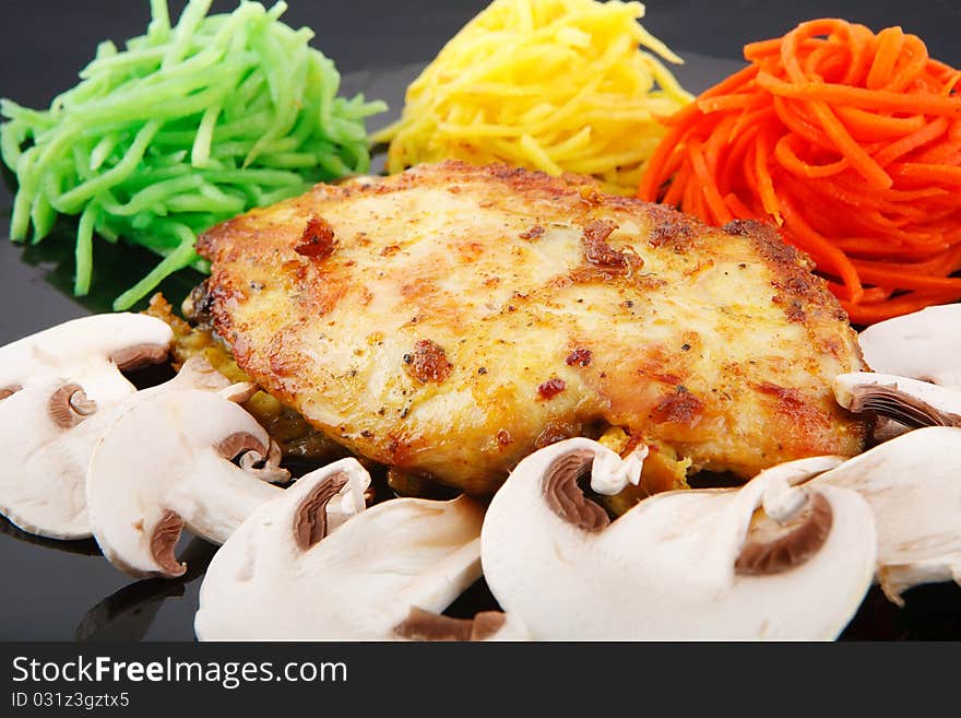 Chicken breast and vegetables on white background. Chicken breast and vegetables on white background