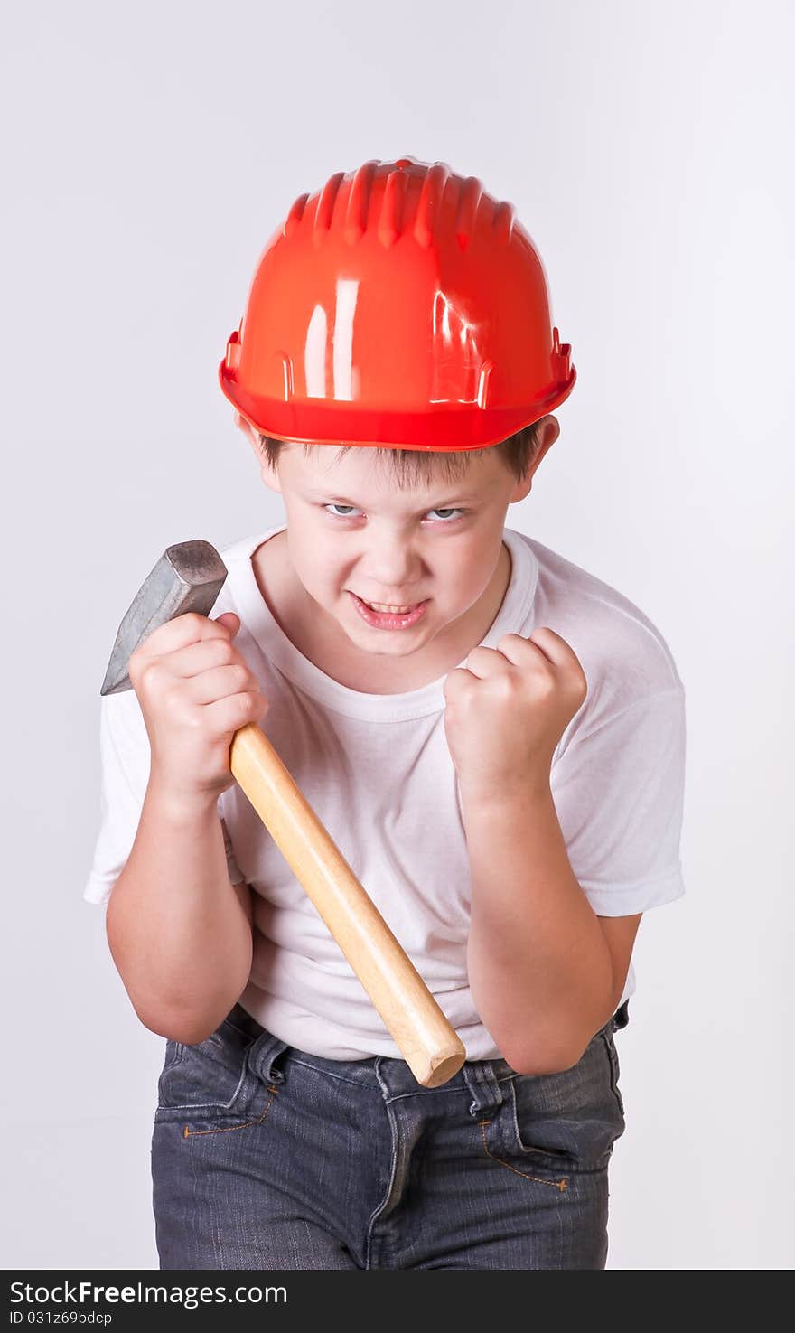 Portrait of a boy in a red protective helmet