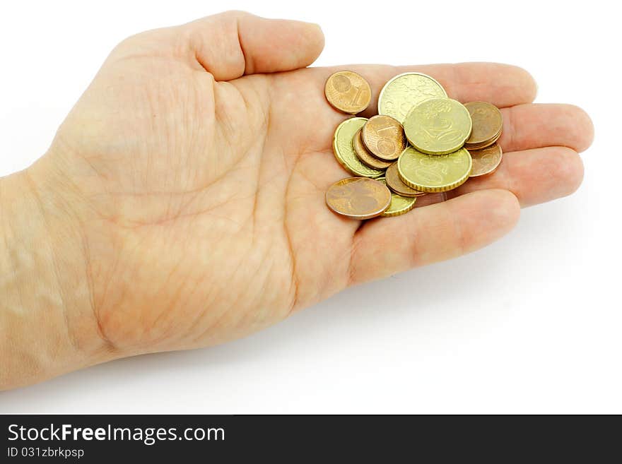 Eurocents on a hand on a white background.