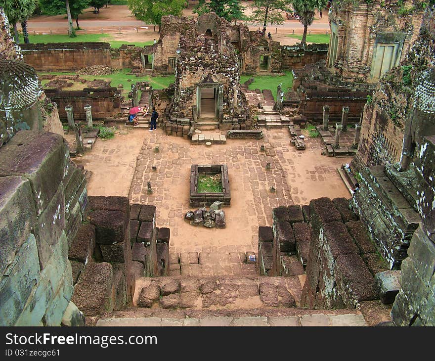 A tomb seen from the top of a pyramid's stairs in the Angkor Thom archeological site. A tomb seen from the top of a pyramid's stairs in the Angkor Thom archeological site