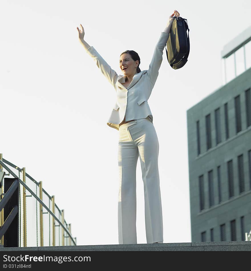 Standing businesswoman with a notebook