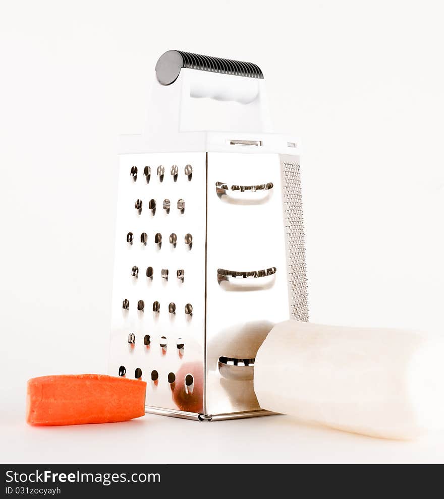 Grater with carrot and radish