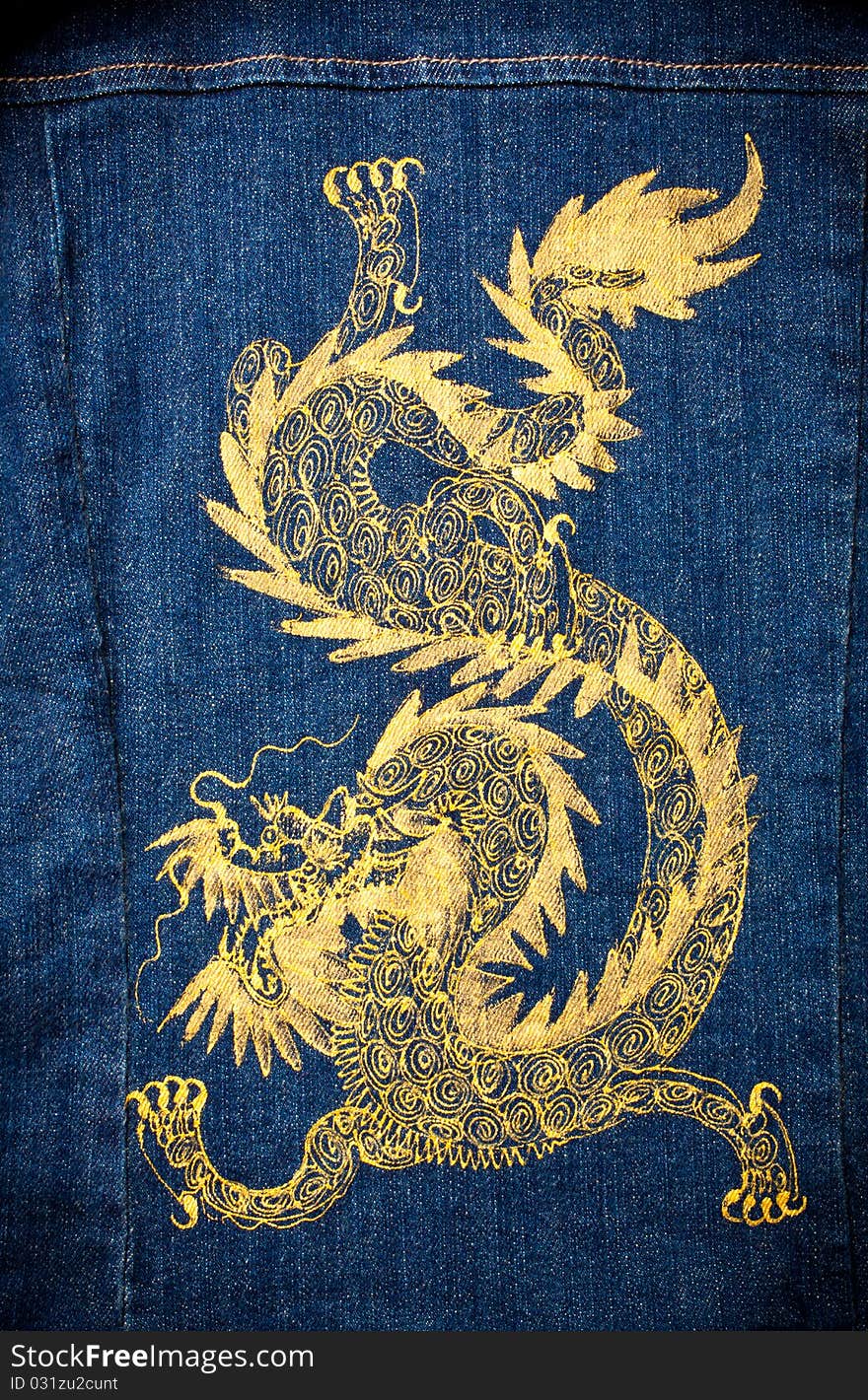 Gold dragon painted on blue jean