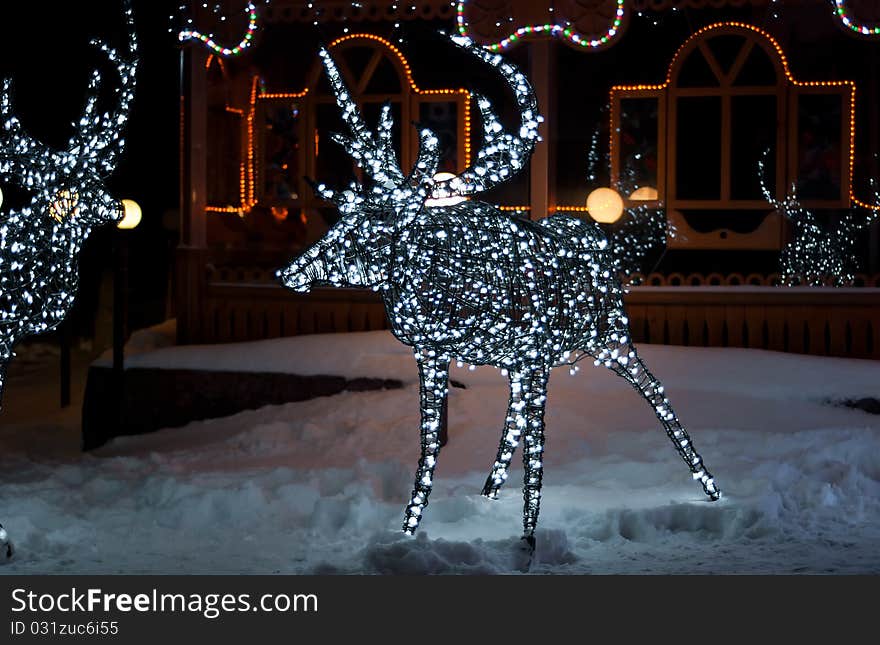 Glowing reindeer made of wire and light bulbs. Glowing reindeer made of wire and light bulbs