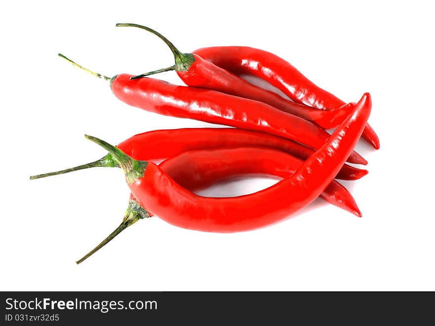 A handful of chili peppers on a white background