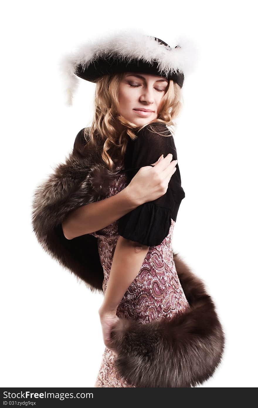 Young woman wrapped in fur isolated on a white background