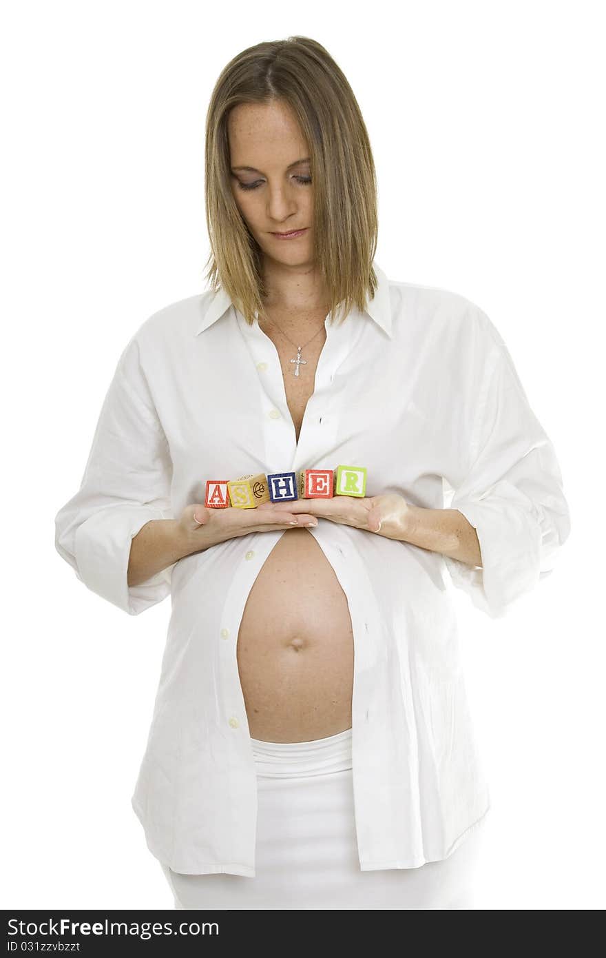 Beautiful Pregnant Woman Holding Baby Blocks