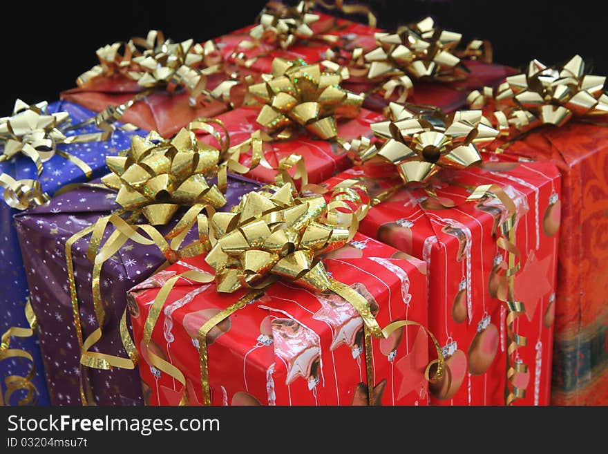 Wait nine with goldbound decorated christmas packages to be given away. Wait nine with goldbound decorated christmas packages to be given away