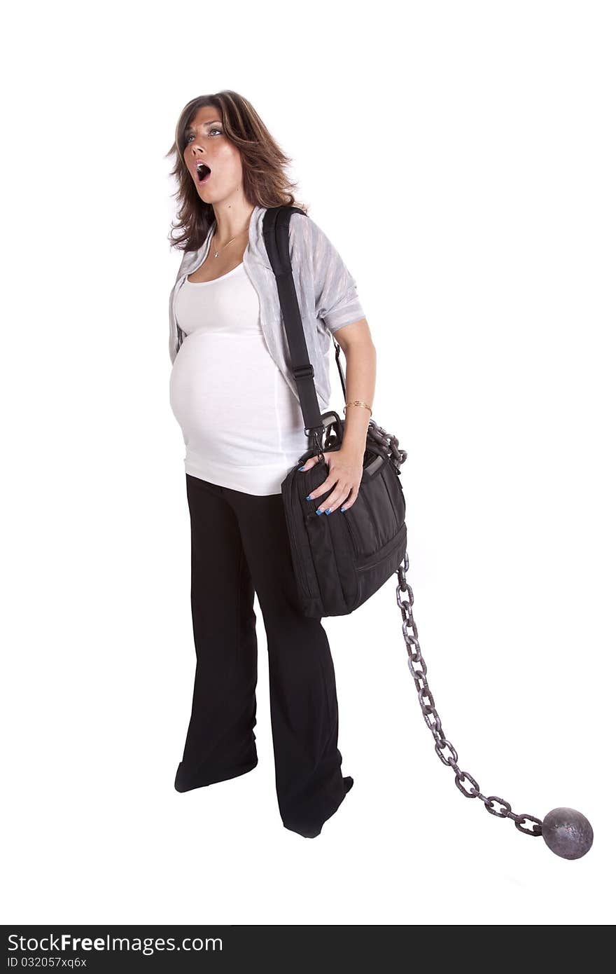 A pregnant business woman with her black bag and chain showing how tired she is by yawning. A pregnant business woman with her black bag and chain showing how tired she is by yawning.